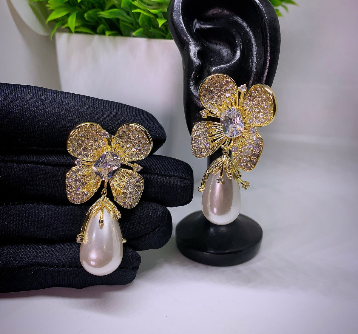 Gold- toned hypoallergenic shell pearl flower stud cubic zirconia earrings