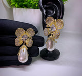Gold- toned hypoallergenic shell pearl flower stud cubic zirconia earrings